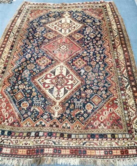 A Persian rug with triple medallion on a blue ground 250 x 160cm